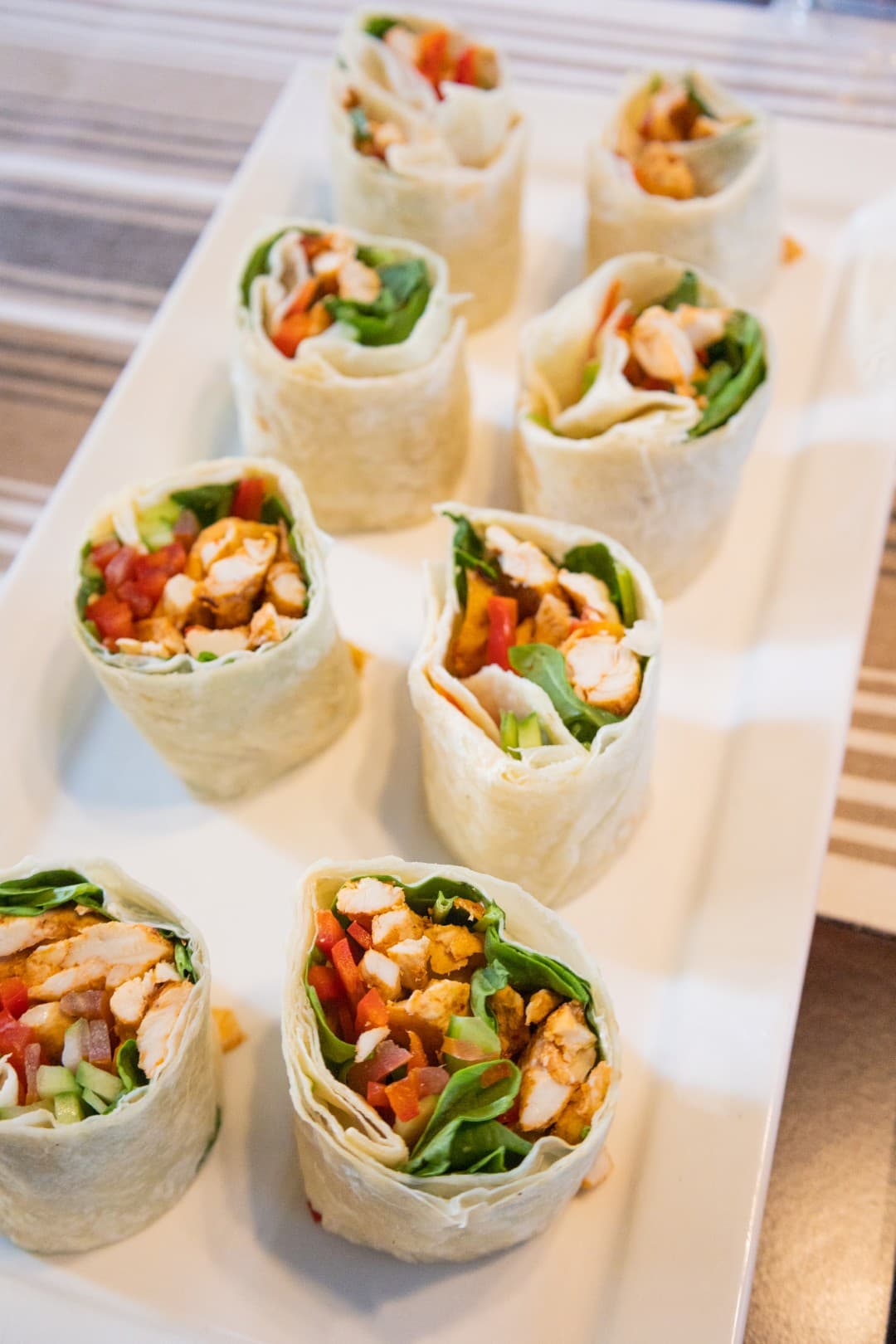 A plate of assorted wraps served during the Burj Coastline Tour, showcasing a variety of flavors and ingredients.