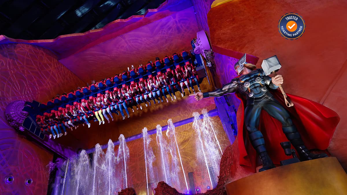 Thrilling indoor roller coasters at IMG Worlds of Adventure with guests enjoying the high-speed rides