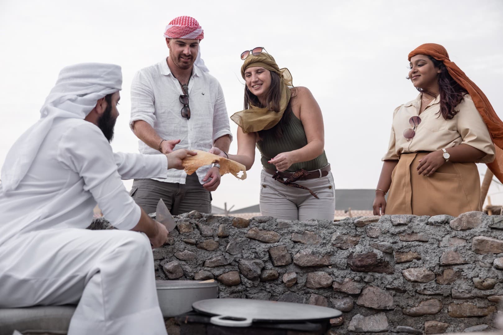 Traditional Bedouin bread making demonstration at the Heritage Desert Safari camp in Dubai.