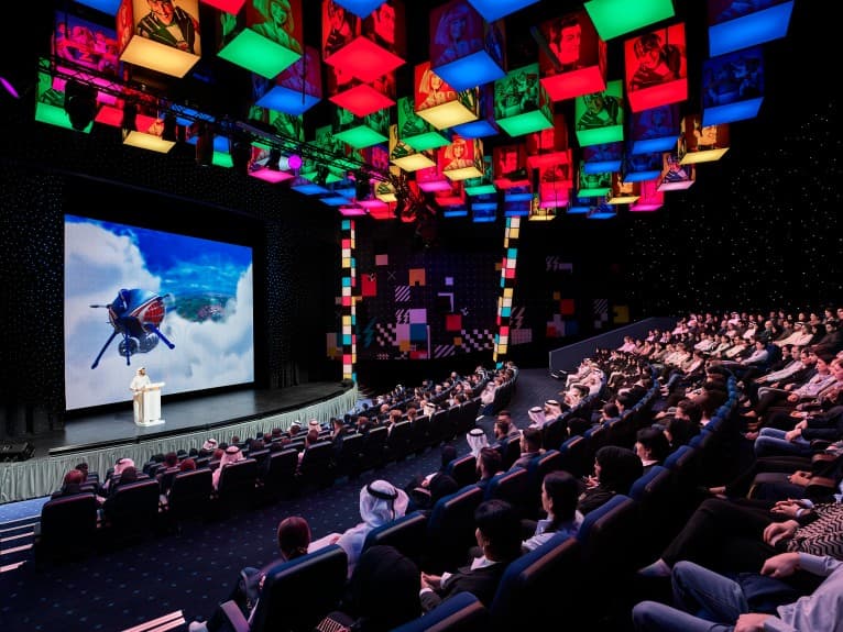 Conference or event area inside IMG Worlds of Adventure with visitors gathered in a themed venue