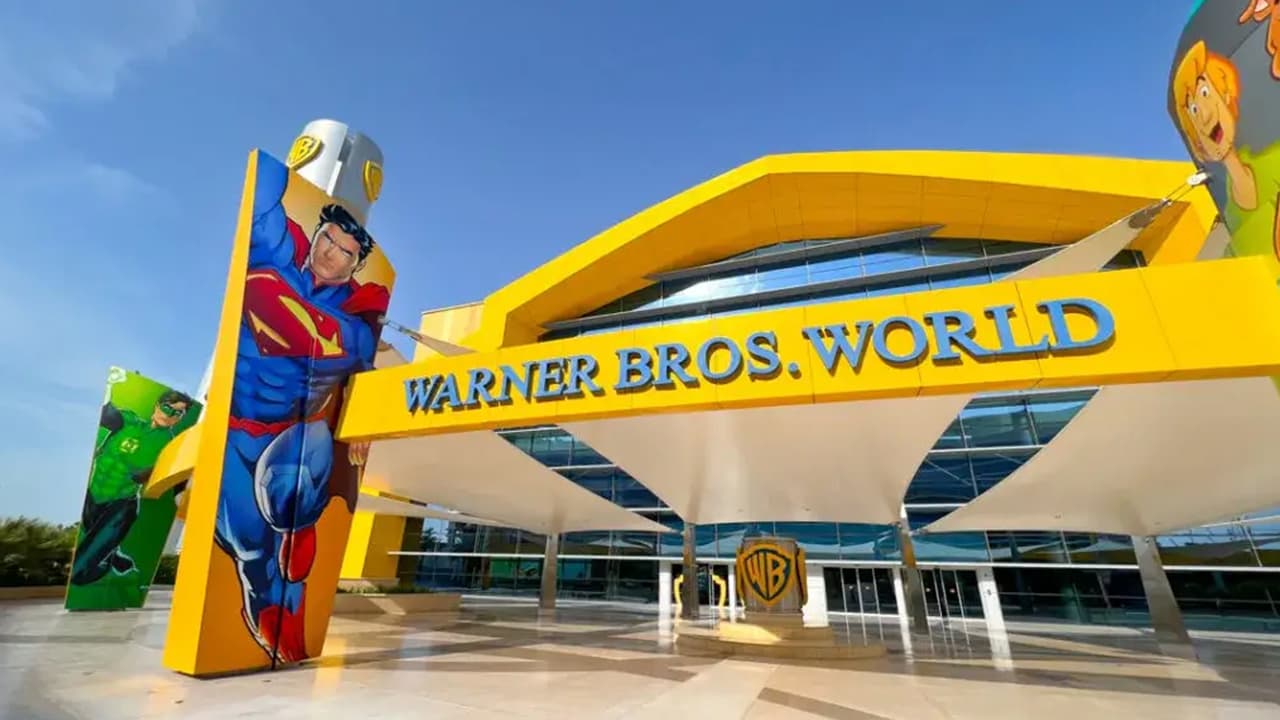 Warner Bros World logo featuring playful cartoon characters representing different conditions.