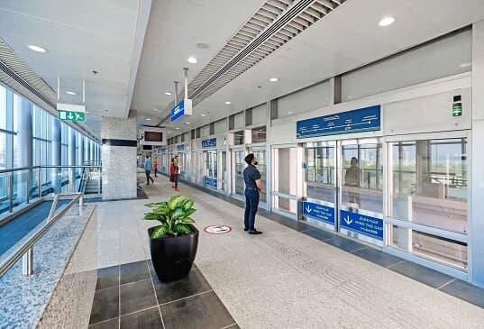 Palm Monorail stations along Palm Jumeirah with modern platforms and views of the island