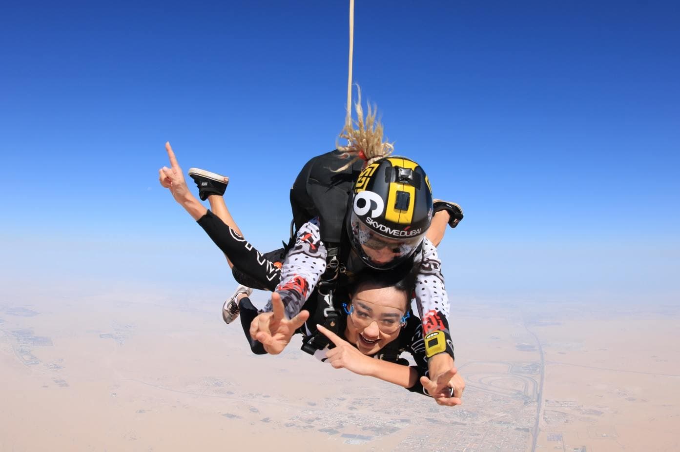 Tourists experiencing skydiving adventure at Skydive Dubai