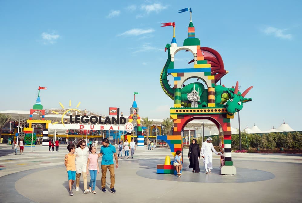 A colorful entrance to LEGOLAND Dubai with a large, vibrant LEGO dragon arch.