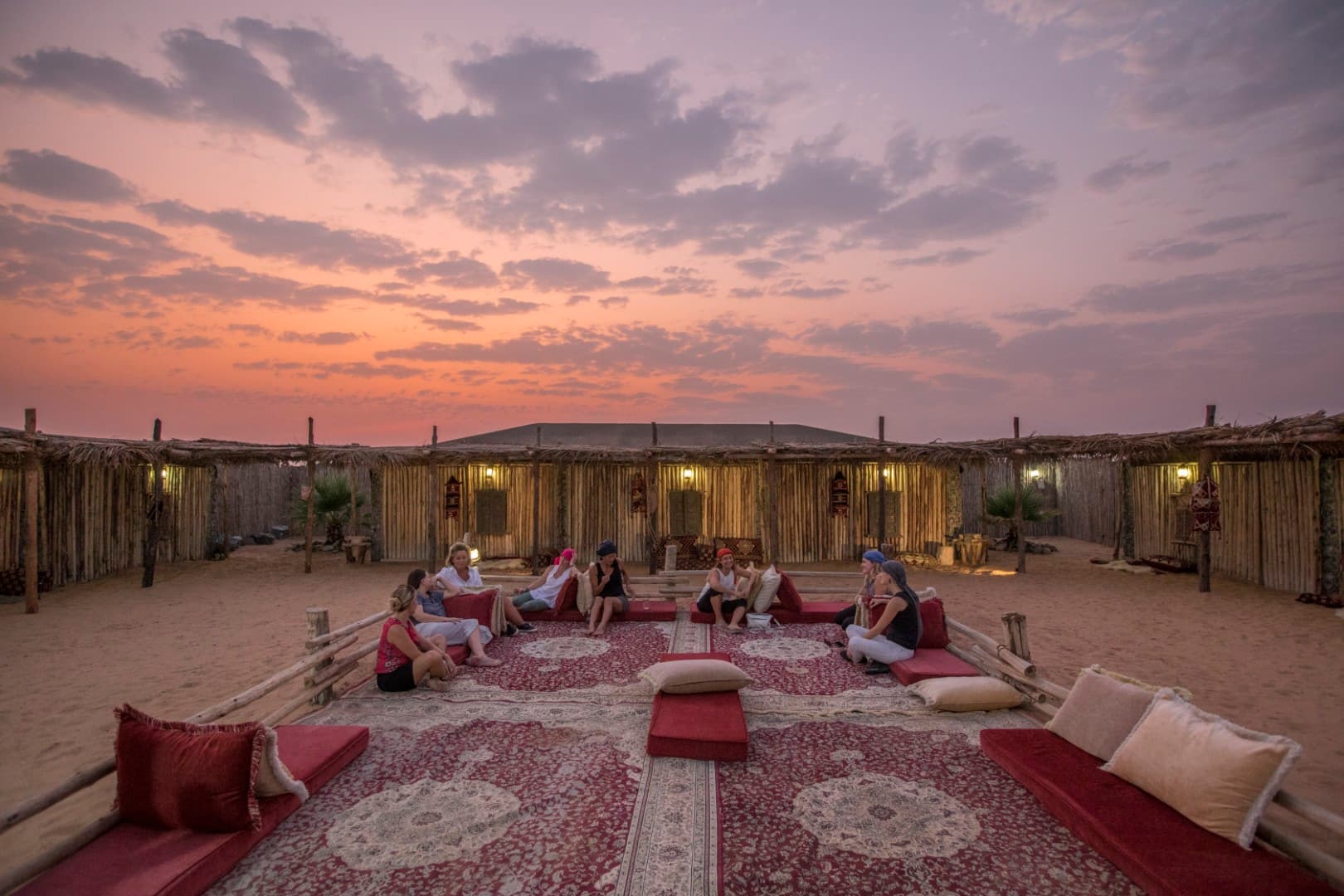 Guests relaxing in the traditional camp majlis at the Heritage Desert Safari in Dubai.