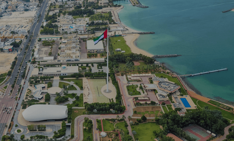 UAE Flag viewed from a private helicopter tour, showcasing its unique architecture and surroundings.