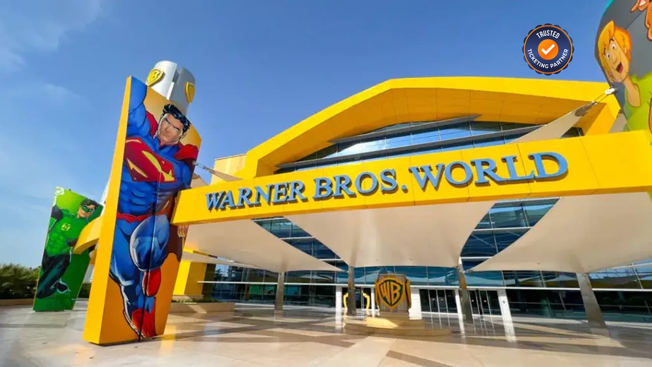 Entrance to Warner Bros. World, featuring vibrant superhero murals, including Superman. 