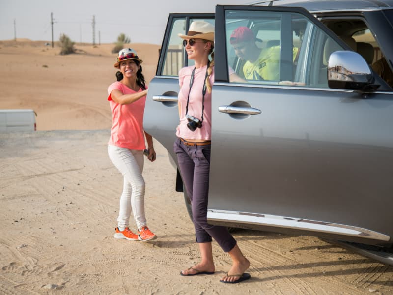 4x4 vehicle driving across the Dubai desert during the hot air balloon adventure experience
