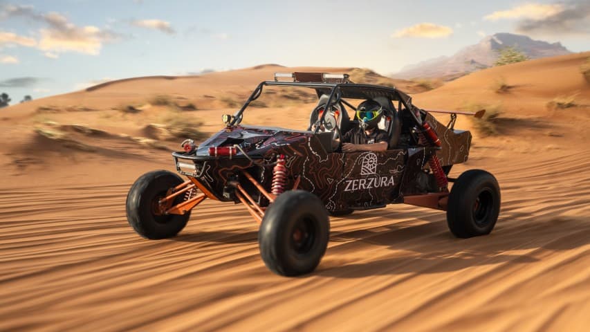 Desert buggy driving through sand during a camp ride adventure.