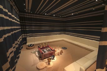 Interior view of the museum inside Qasr Al Hosn showcasing historical exhibits and cultural displays.