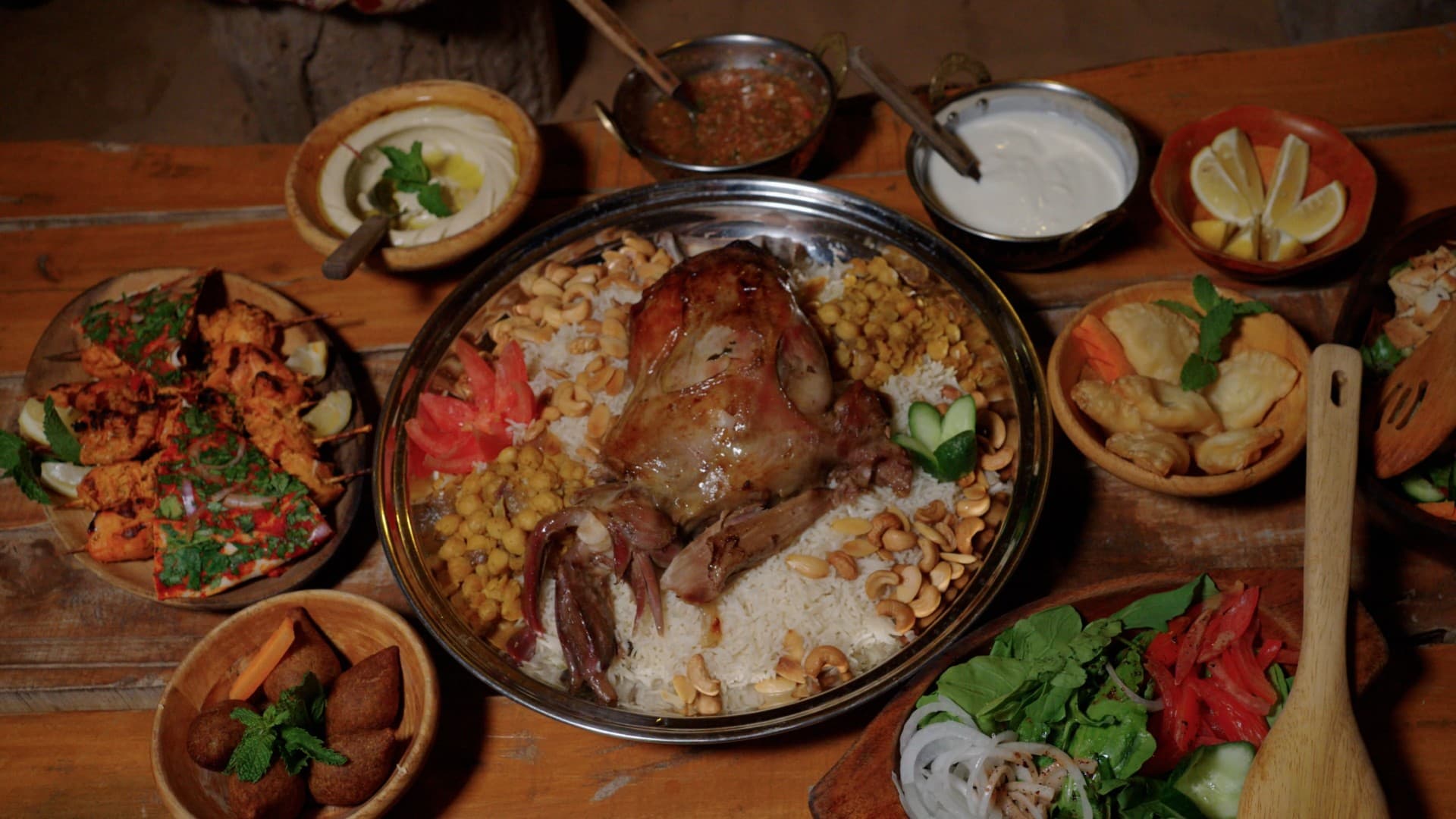 Traditional Arabic food served at the Bedouin camp during the Heritage Desert Safari experience in Dubai.