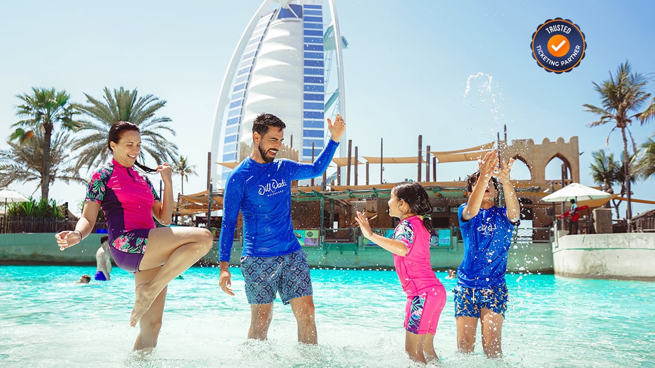 Father playing with kids in the water at Wild Wadi Waterpark while enjoying family time