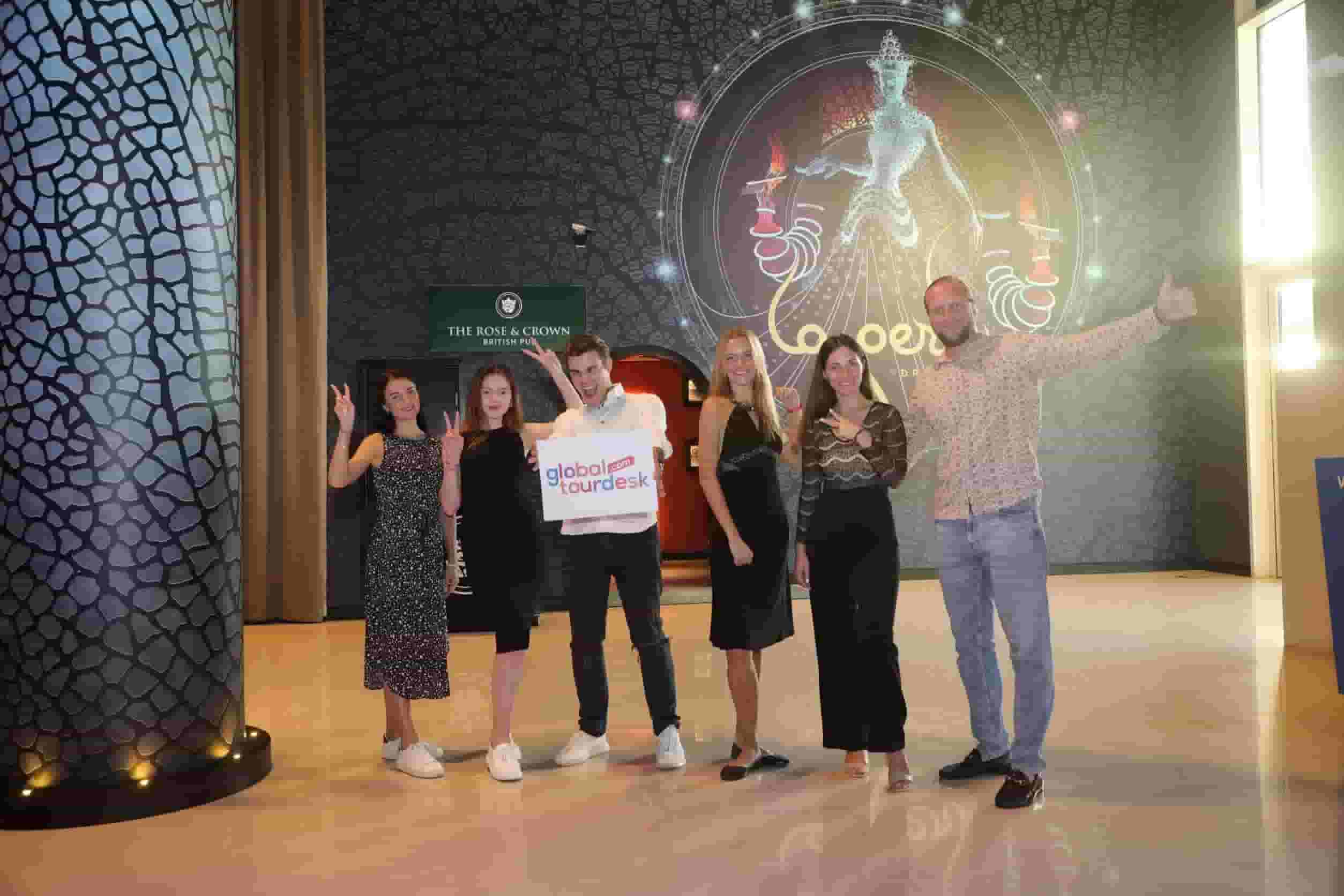 Friends capturing a photo moment during the La Perle by Dragone show experience in Dubai.