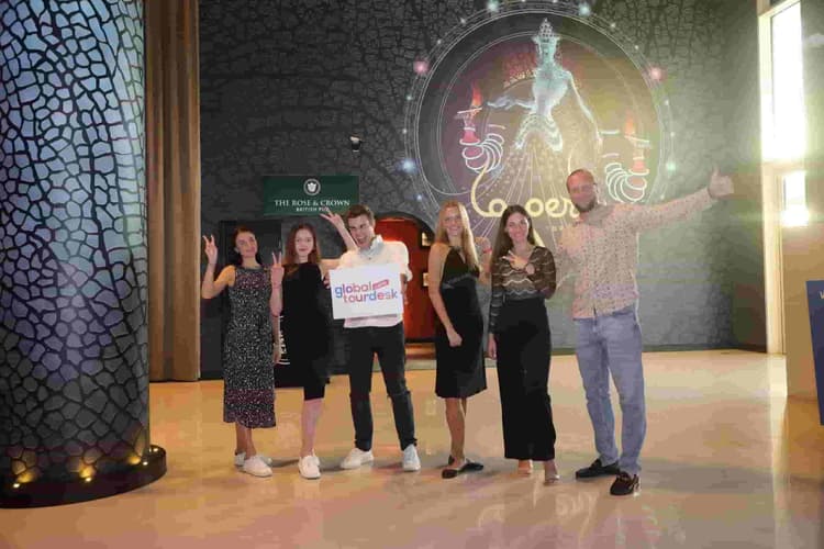 Friends capturing a photo moment during the La Perle by Dragone show experience in Dubai.