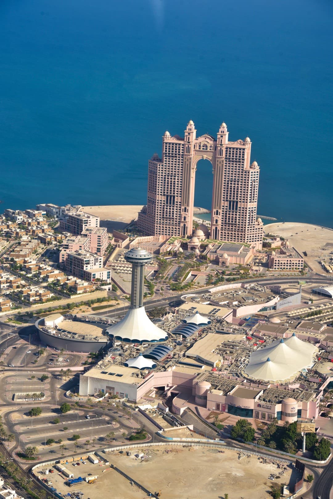 A large building in Abu Dhabi's cityscape, viewed from a helicopter during the Rixos tour.
