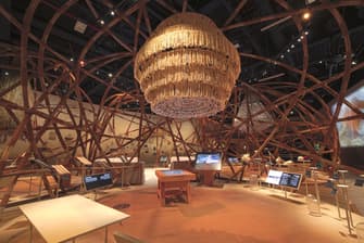 Spacious museum hall inside Qasr Al Hosn displaying historical artifacts and cultural exhibits.