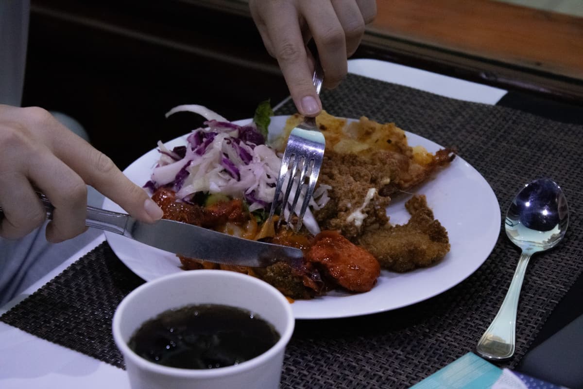 Dining experience with sunset skyline on a Marina dhow cruise