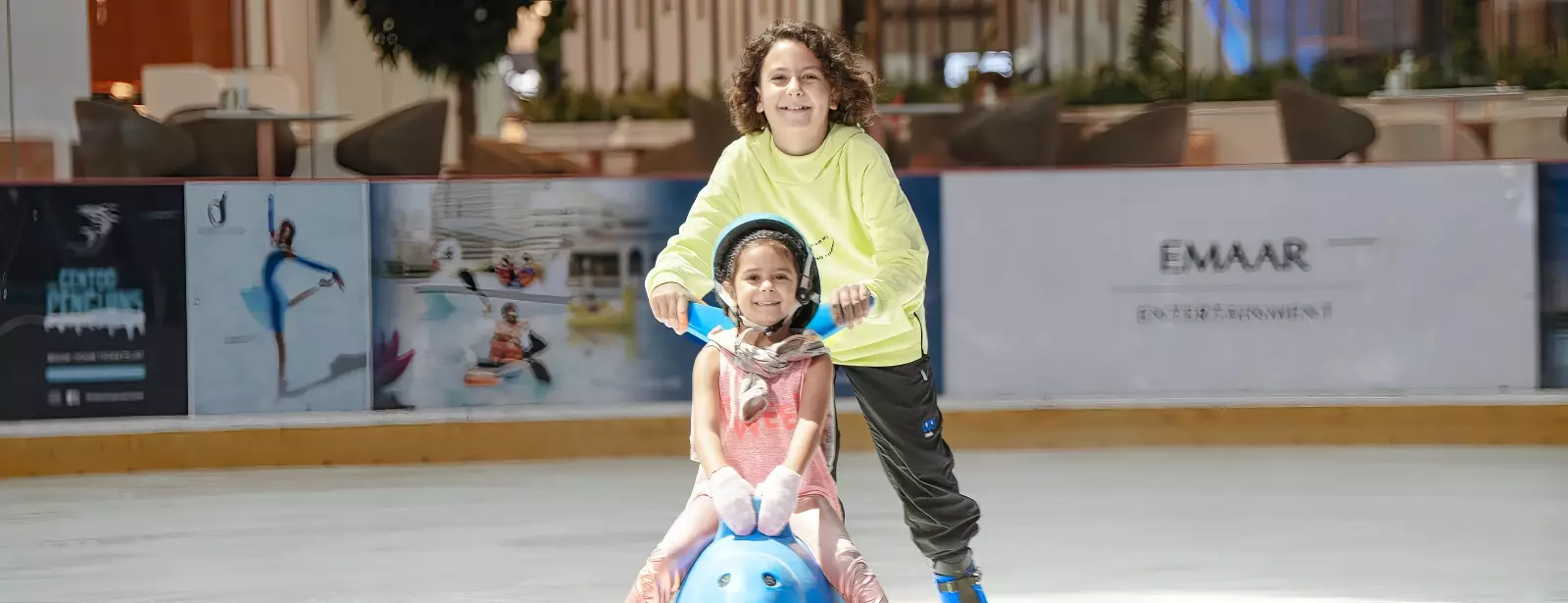 Kids practicing ice skating at the Dubai Ice Rink, learning and enjoying the indoor activity.