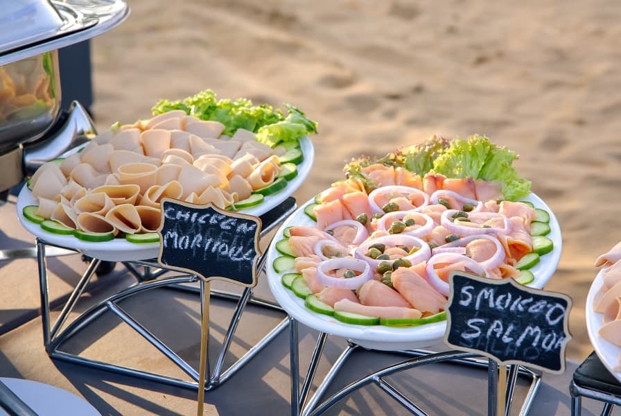 Guests enjoying a traditional breakfast in the desert after a hot air balloon ride in Dubai.