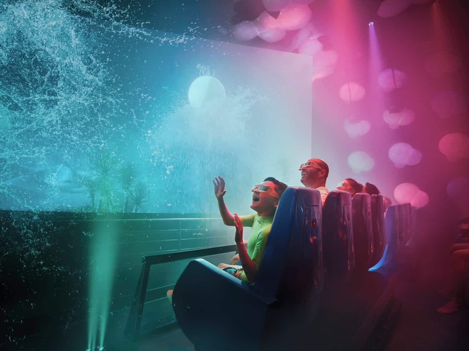 Guests watching a fun water movie experience at the Cine Splash attraction in Yas Waterworld Abu Dhabi.