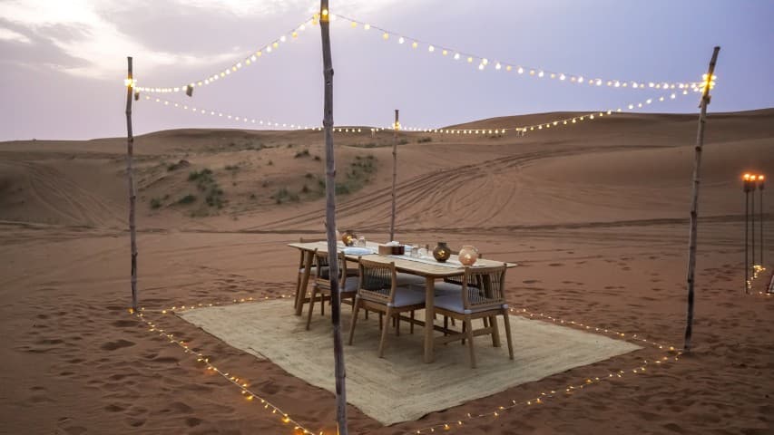 Experience a sunset dinner in the middle of the desert with a Mleiha buggy adventure.