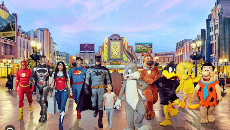 Families and visitors enjoying attractions together inside Warner Bros. World Abu Dhabi.