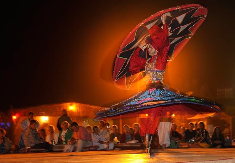 Traditional Tanura dance performance at a private desert safari camp in Dubai.
