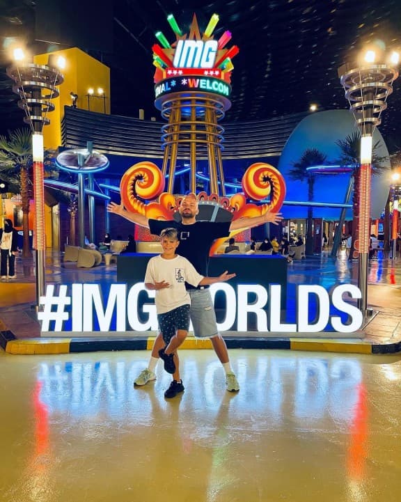 Tourists taking photos with themed attractions and characters at IMG Worlds of Adventure