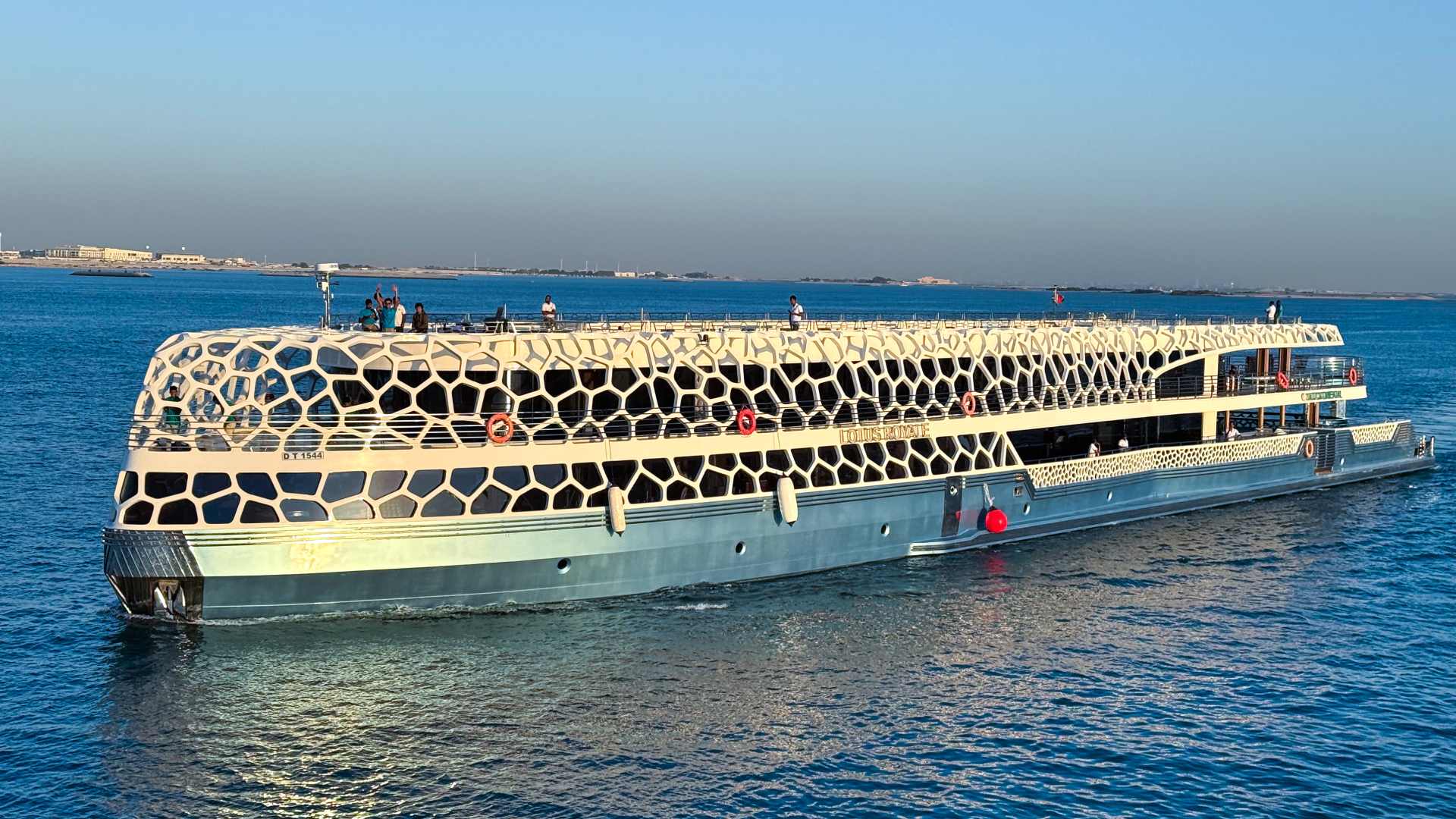 Panoramic view of the Lotus Royale yacht during evening cruise