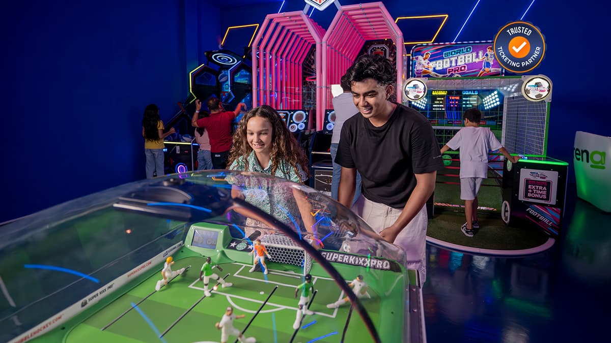 Kids playing interactive indoor football games at Real Madrid World theme park