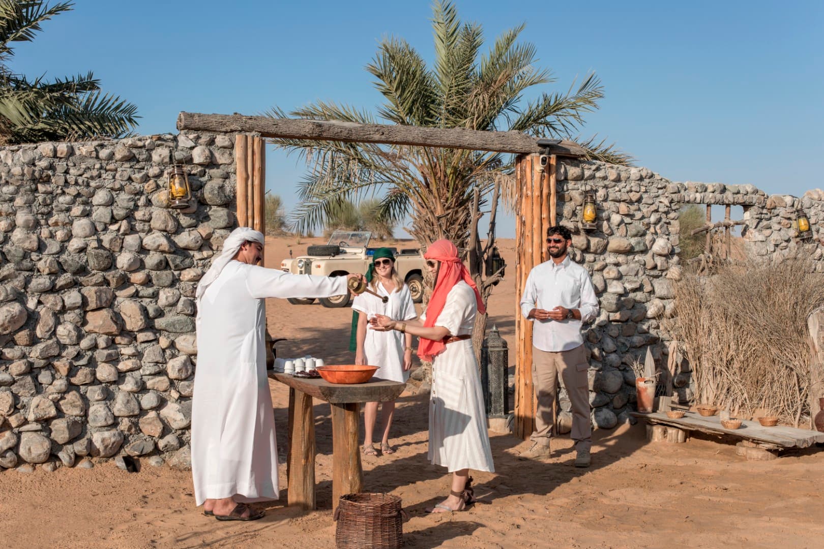 Guests receiving a traditional welcome at the Bedouin camp during the Heritage Desert Safari in Dubai.