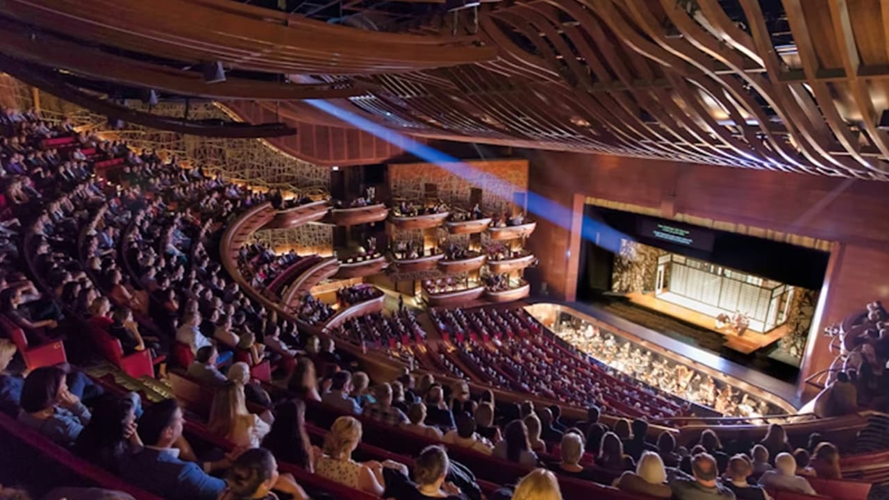 Interior view of the Dubai Opera during the Opera Grand Tour, showing the elegant auditorium and seating area inside the theatre.