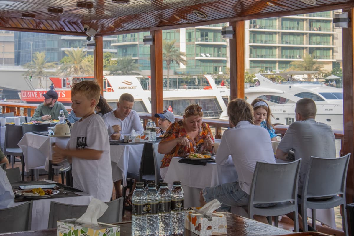 Dining experience on a dhow cruise with Dubai Marina sunset skyline