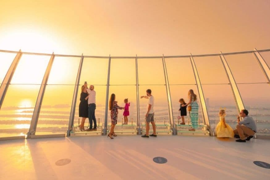 Visitors enjoying panoramic views of Palm Jumeirah from the observation deck at The View at The Palm.
