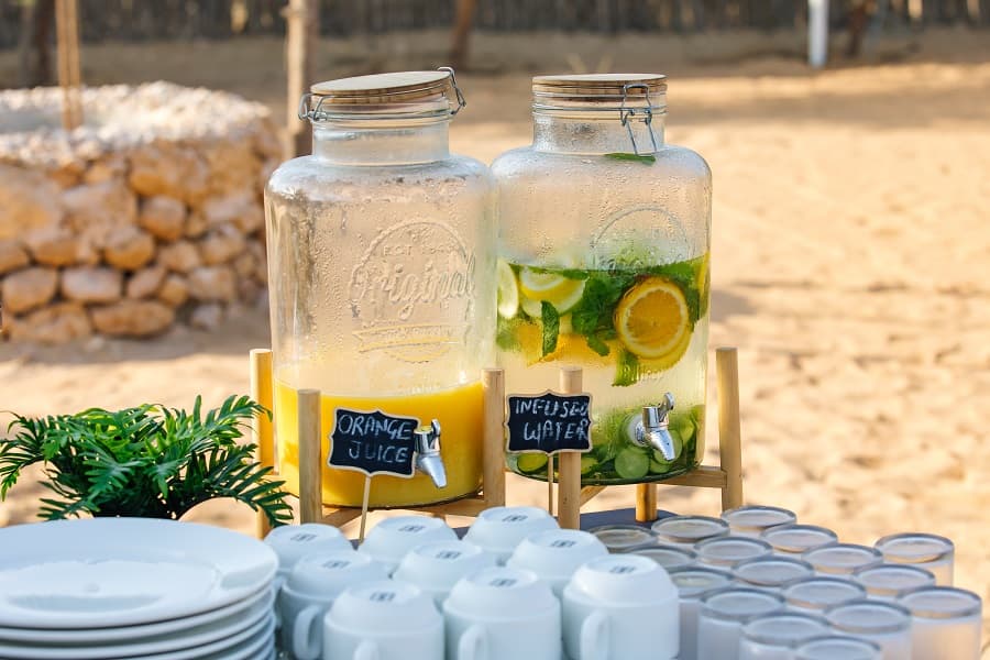 Guests enjoying refreshments in the desert during the Dubai hot air balloon experience.
