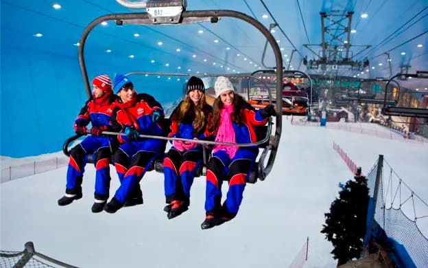 Visitors riding the chairlift above the indoor snow slopes at Ski Dubai