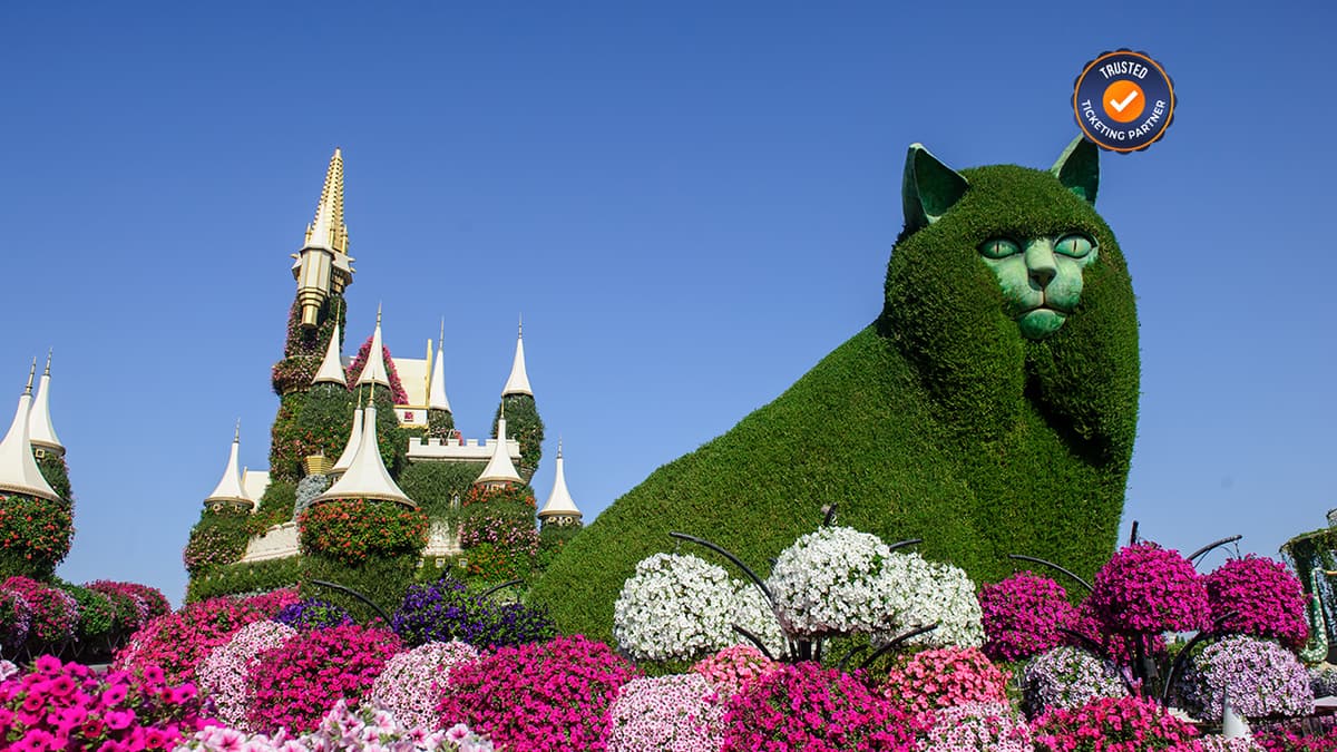 Colorful cat sculpture with Russian-style floral buildings display at Dubai Miracle Garden