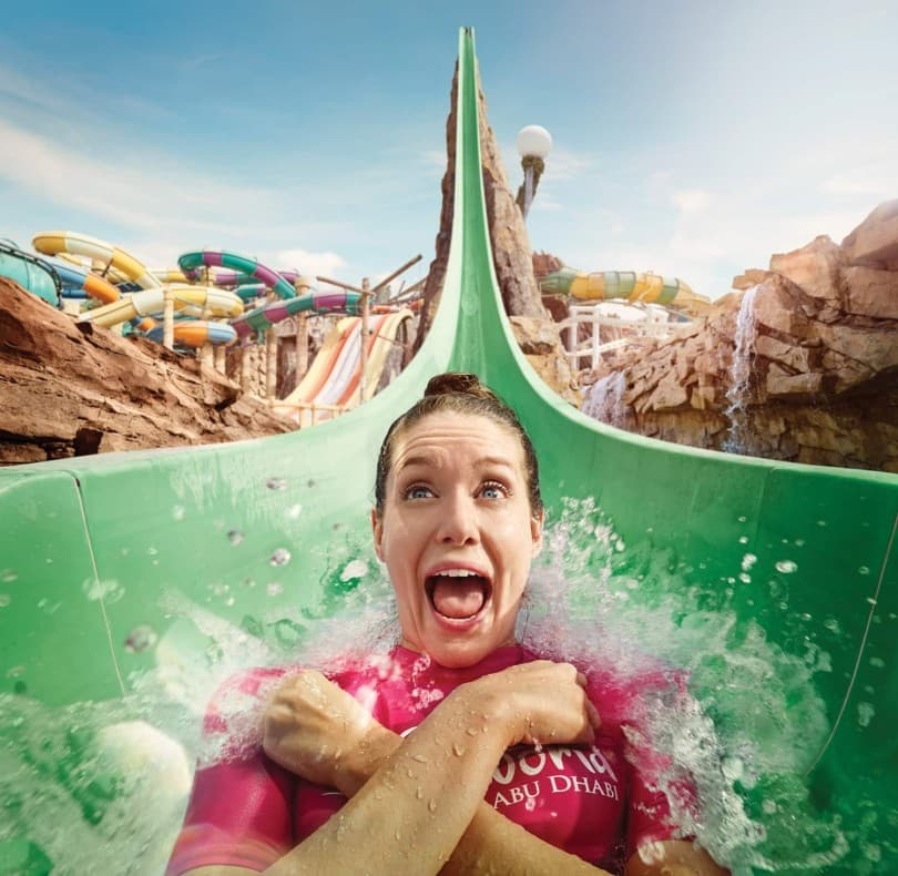 Guests enjoying the main water slide attraction at Yas Waterworld Abu Dhabi.
