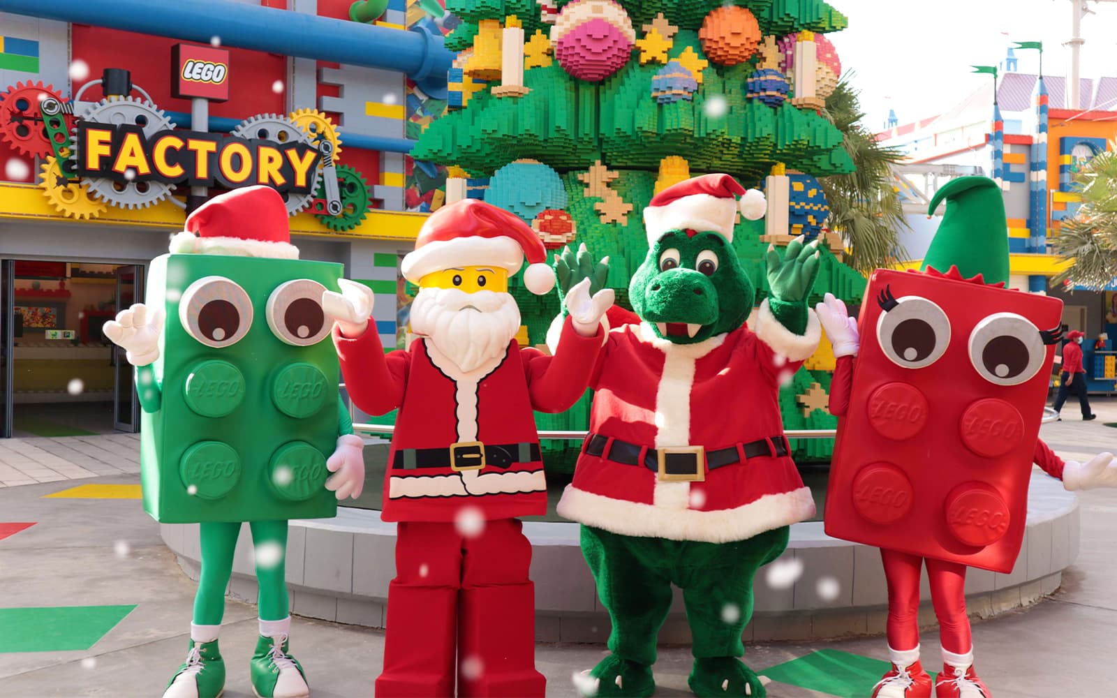 LEGO themed Christmas tree outside with four colorful characters