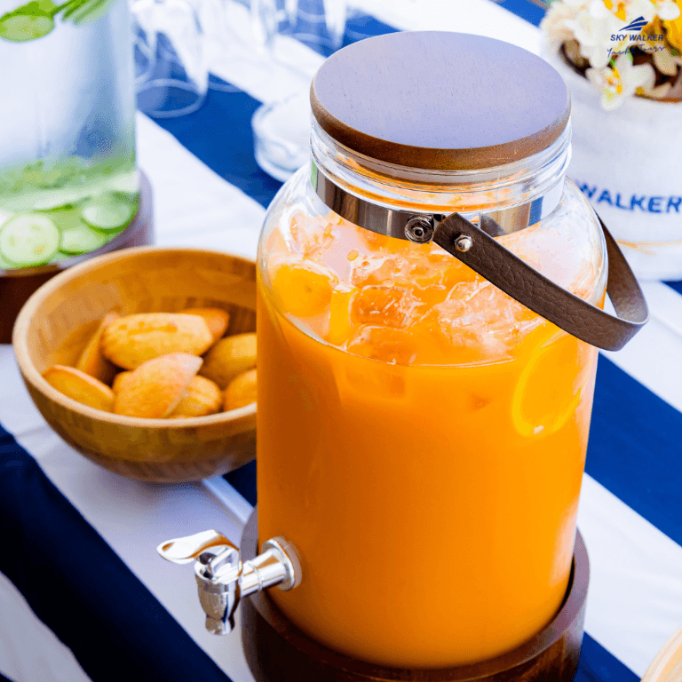 A glass jar with a handle, featured in the Burj Coastline Tour, showcasing refreshing juices.