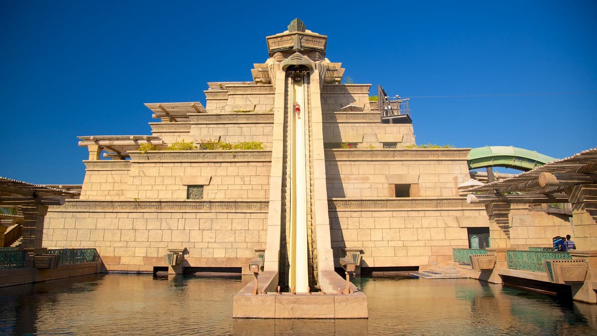 A large water slide at Atlantis Aquaventure, surrounded by attractions of the Lost World Aquarium.