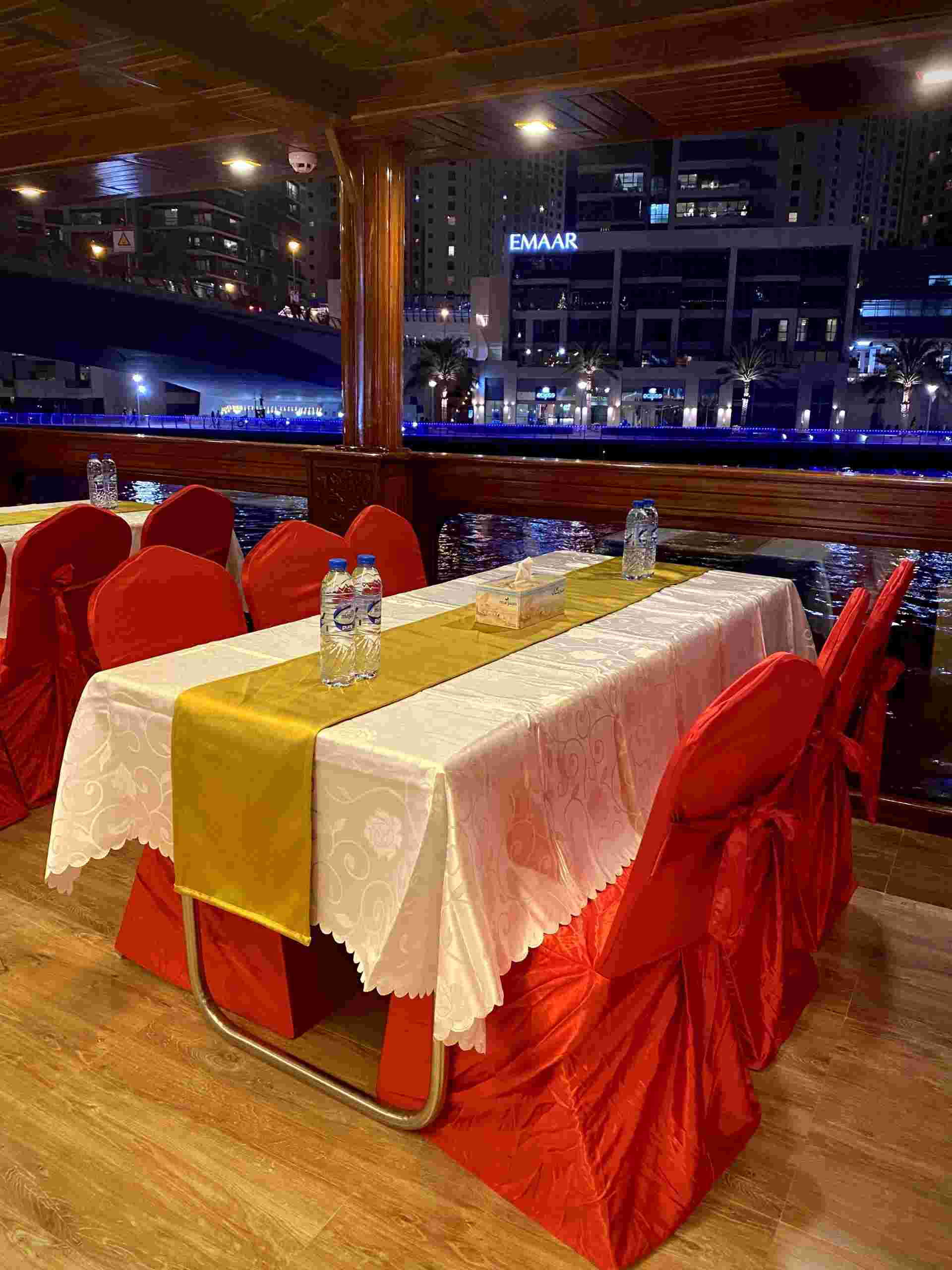 Comfortable indoor seating area on the Mega Dhow dinner cruise
