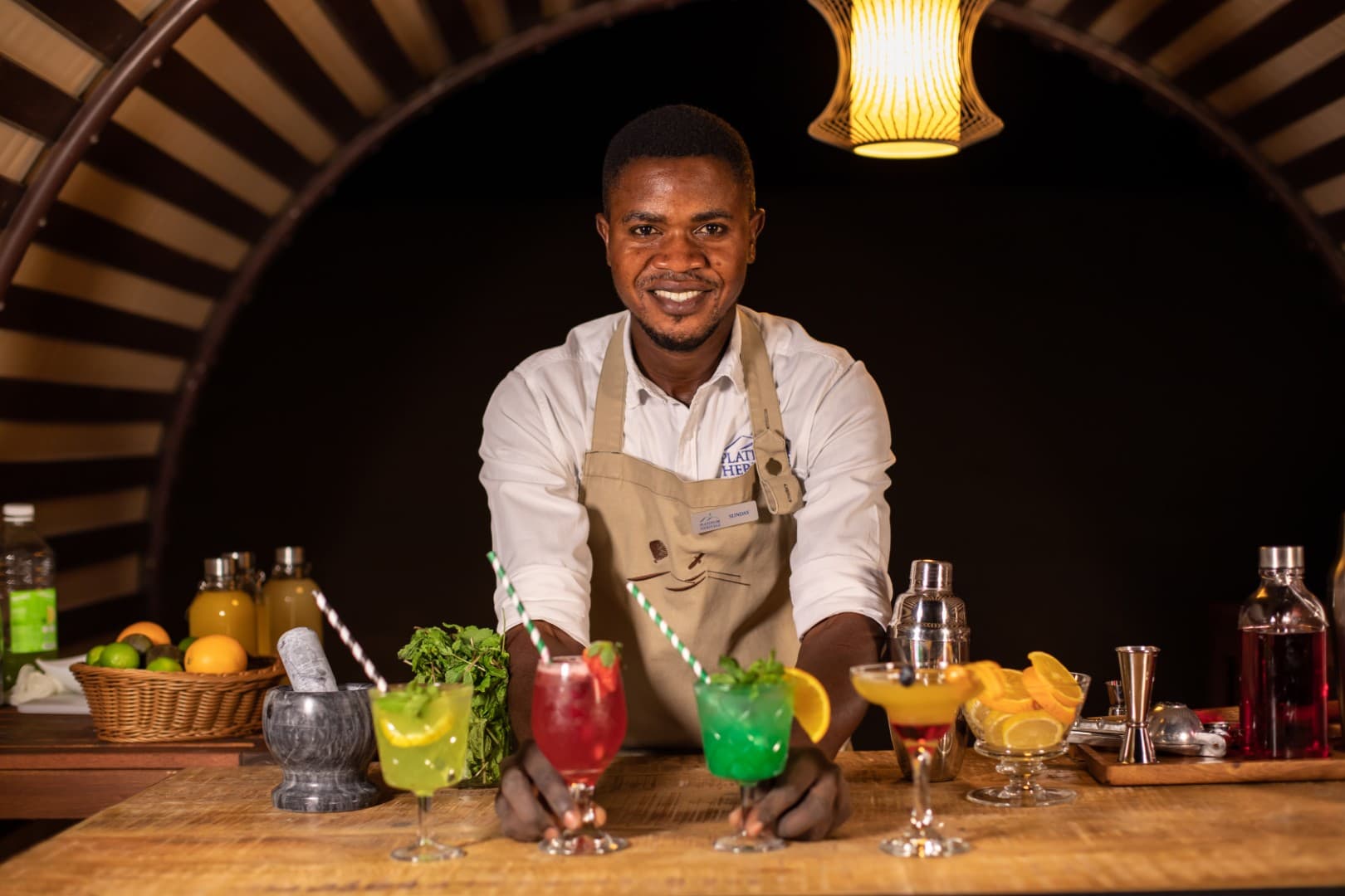 Michelin-star chef preparing gourmet dishes at the Platinum Desert Safari luxury dining experience in Dubai.