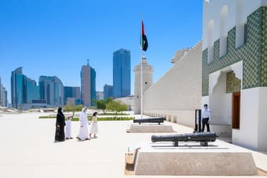 Main entrance of Qasr Al Hosn in Abu Dhabi with visitors approaching the historic fort