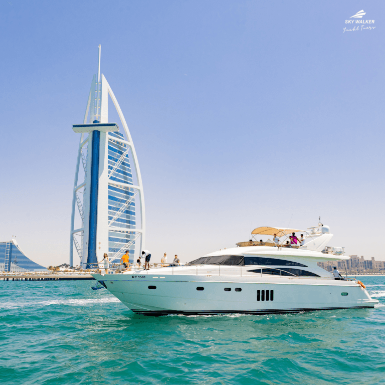 A boat gliding on water near the Burj Al Arab during the Burj Coastline Tour.