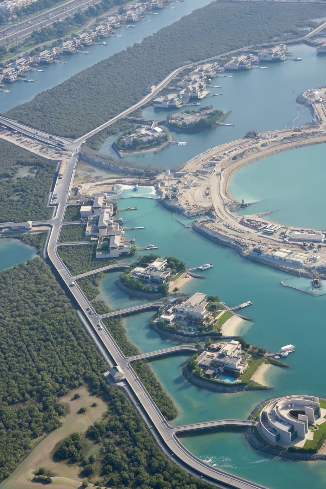 Aerial view of blue waters during a helicopter tour in Abu Dhabi, showcasing the stunning coastal landscape.