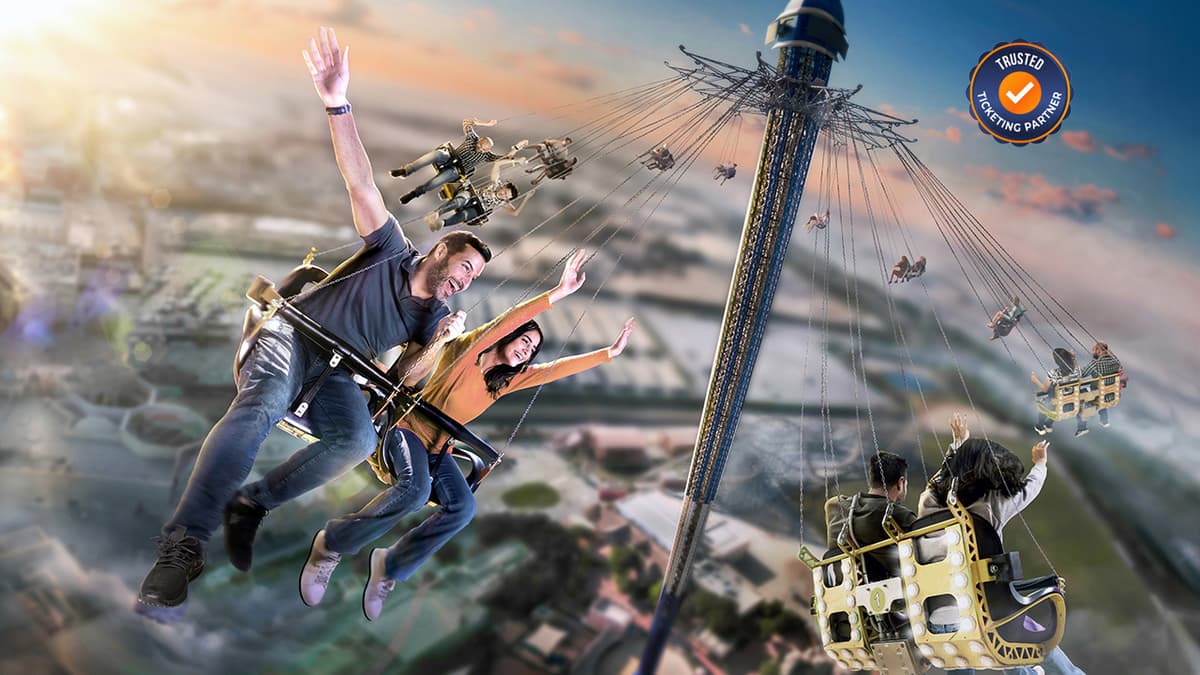 Couple and kids enjoying football-themed rides together at Real Madrid World in Dubai Parks and Resorts