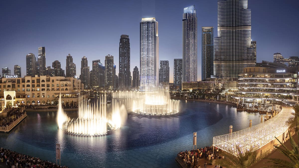 Russian-speaking tourists watching the Burj Khalifa fountain show during a Dubai city tour.