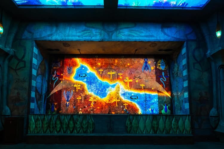 A large screen displaying a vibrant image from the Lost World Aquarium, showcasing colorful aquatic life.