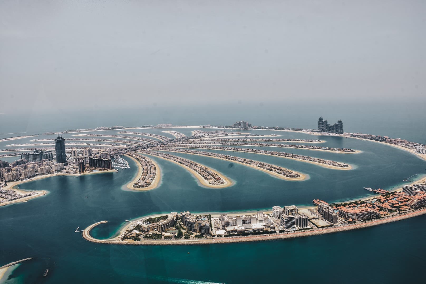 Aerial view of the Palm Jumeirah in Dubai, showcasing the artificial archipelago shaped like a palm tree.